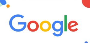Google company logo in signature colors - blue G, red o, yellow o, blue g, green l, red e - with decorative colored circles on white background