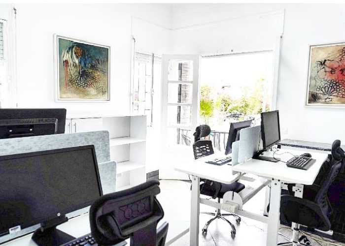 Dedicated workstations or a small team office space at Al Hub Coworking
