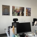 A modern, well-lit coworking office space at Al Hub in Rabat, featuring multiple white desks, ergonomic chairs, and privacy dividers, suitable for focused work or a small team.